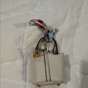 Elegant Cream Handbag Charm with Scarf Accent